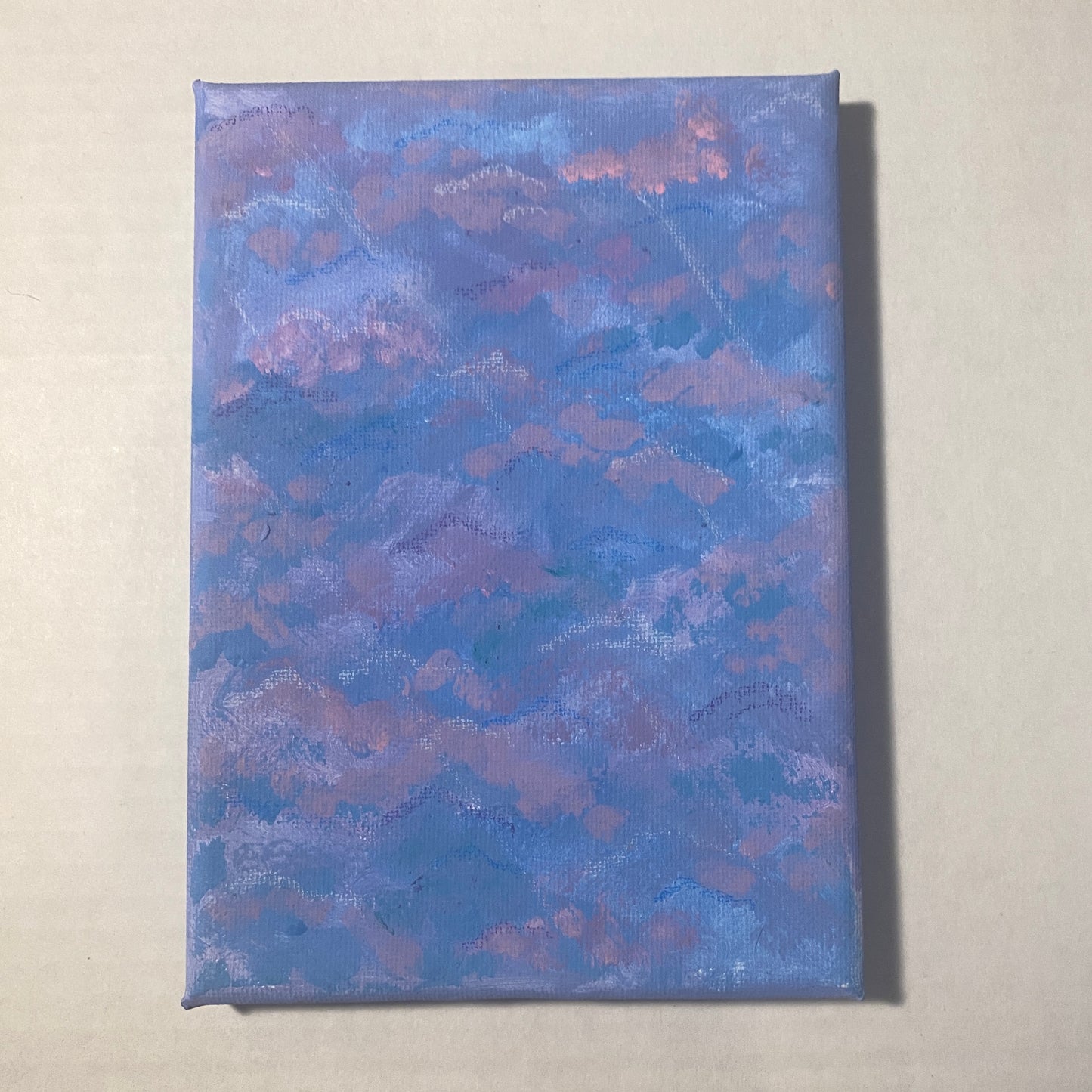 Short lines of white colored pencil run diagonally across muted blue and purple clouds filling the entire background, appearing like light seeping through.