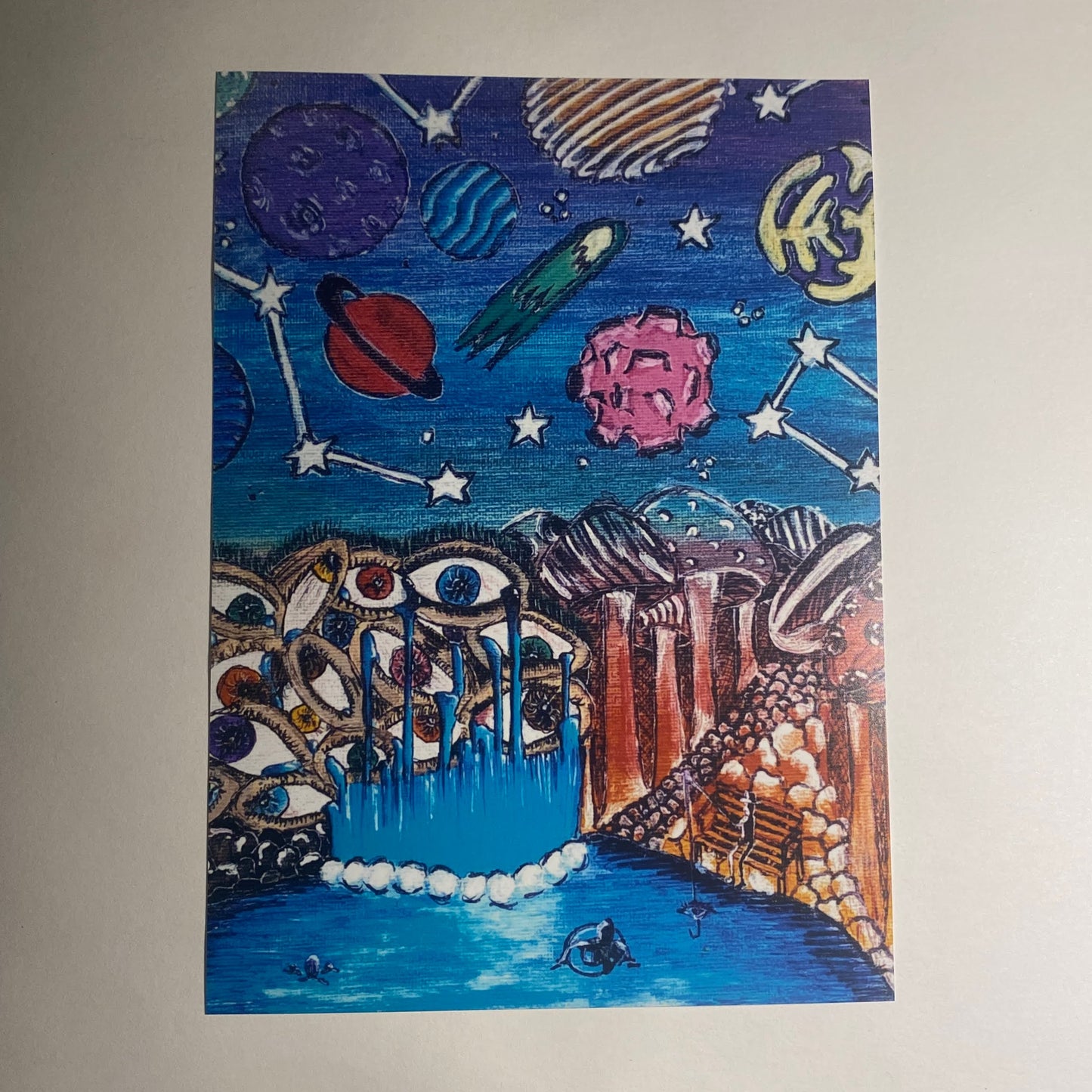 This wacky painting is a multi-media creation including planets, a waterfall made of eyes, and mushrooms as tall as redwood trees. Uses marker, pen, colored pencil, gel pen