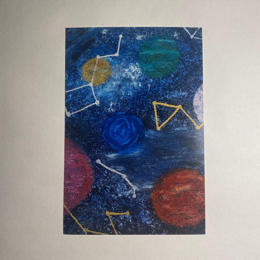 A deep blue background is covered with oil-pastel planets and metallic marker constellations in this deep-space piece.